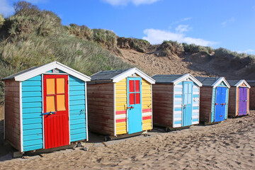 Fototapeta na wymiar Beach huts at Saunton Sands beach, Devon 