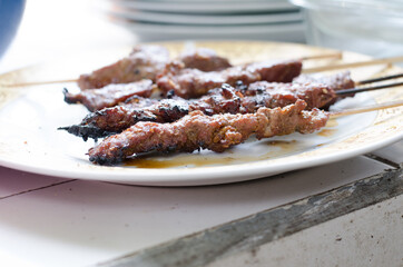 Beef satay with peanut sauce, indonesian skewer cuisine