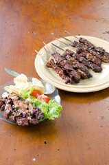 Beef satay with peanut sauce, indonesian skewer cuisine