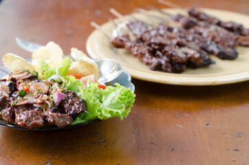 Beef satay with peanut sauce, indonesian skewer cuisine