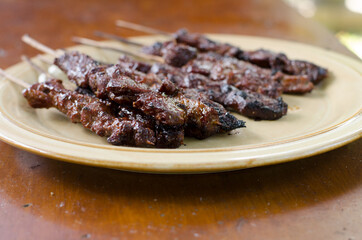 Beef satay with peanut sauce, indonesian skewer cuisine