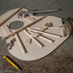 Classical guitar under construction in luthier workshop
