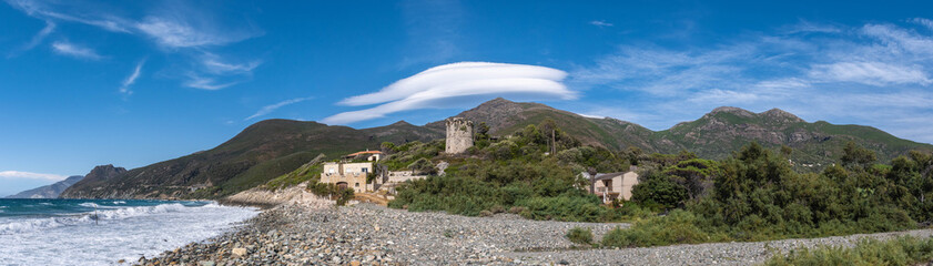Fototapeta na wymiar panorama of the mountains in sea under a lenticular cloud
