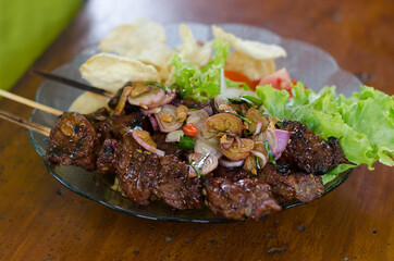 Beef satay with peanut sauce, indonesian skewer cuisine