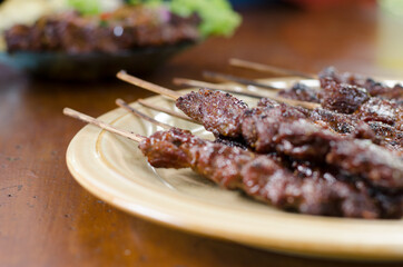 Beef satay with peanut sauce, indonesian skewer cuisine