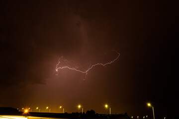 lightning falling at night during a thunderstorm