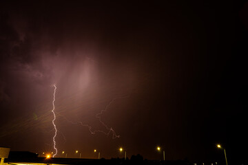 lightning falling at night during a thunderstorm
