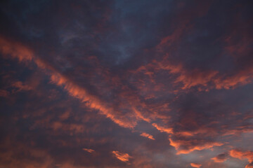 The sunset sky is blue-purple with bright clouds