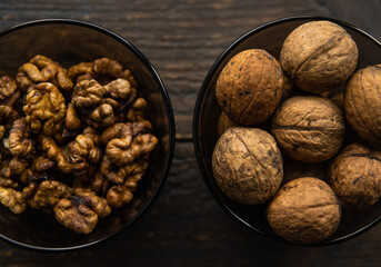 Walnut in a small plate on a vintage wooden table. Walnuts is a healthy vegetarian protein nutritious food. Natural nuts snacks.