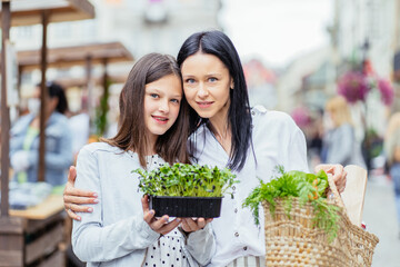 Family mother and child girl with organic vegetables healthy eating lifestyle vegan food homegrown carrot and beetroot local farming grocery shopping agriculture concept