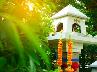 Modern design white shrine of god , Spirit house green leaf and sunrise background, east asia culture, thailand 