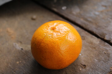 orange on wooden table