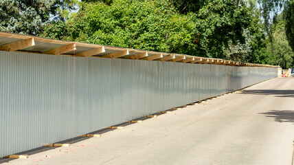 grey fence enclosing the construction site
