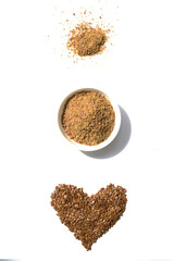 Flax seed set. Ground flax and heart. Healthy eating. White background