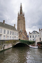 View of Bruges medieval cityscape and Our Lady tower. Church of Our Lady.