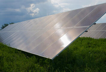 A solar power plant is installed on the ground for the needs of an individual household