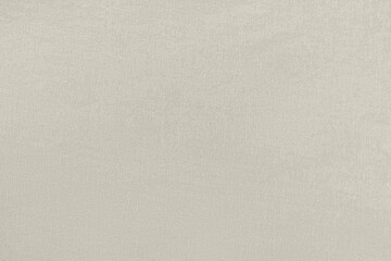 Almond homogeneous background with a textured surface, fabric.