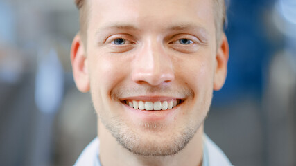Close Up of a Handsome Young Blond Male Portrait Shot. He's a Professional Employee. Man Looks and...