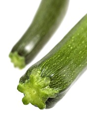 LONG COURGETTE OR ZUCCHINI cucurbita pepo AGAINST WHITE BACKGROUND