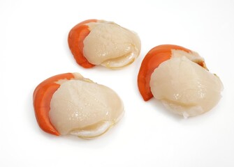 FRESH SCALLOPS pecten maximus AGAINST WHITE BACKGROUND