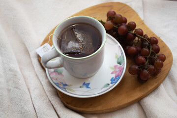 cup of te and grapes