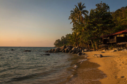 The sun shining on Melina Beach at sunset, Tiomen Island, Malaysia