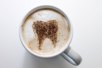 coffe cup with froth and tooth pattern top view