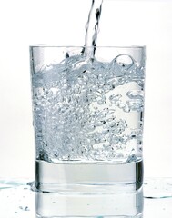 GLASS OF WATER AGAINST WHITE BACKGROUND
