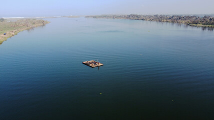 a bamboo raft is driving on the Opak river