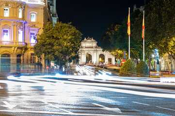 Fototapeta na wymiar Night picture of Puerta de Alcala with traffic in Madrid, Spain