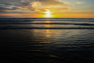 Sunset at beautiful beach at Canoa, pacific coast, Puerto Lopez, Manatí, Ecuador