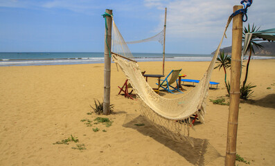 Empty hammock on sandy beach at Canoa, Ecuador, Pacific coast (holiday, fun, lazy)