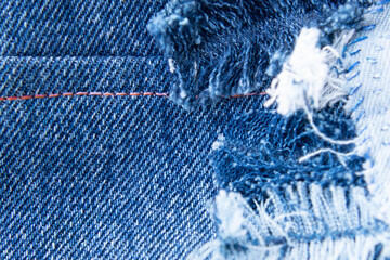 Denim bird feathers - blue denim jeans patchwork pattern. Concept of old jeans reuse and natural resources preserving. 