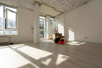 Home renovation in room full of painting tools