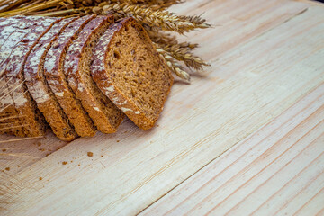 Sliced Multigrain. Rye bakery with crusty loaves and crumbs. Fresh loaf of rustic traditional bread...