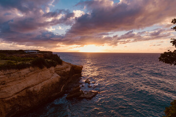sunset on the cliffs On the arch of Anguilla island in the Caribbean sea