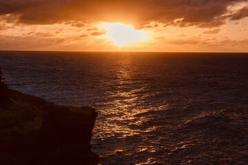 Fototapeta premium sunset on the cliffs On the arch of Anguilla island in the Caribbean sea