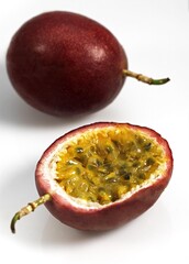PASSION FRUIT passiflora edulis AGAINST WHITE BACKGROUND