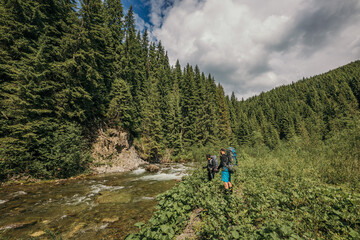 Fototapeta premium A person riding a bike down a dirt road