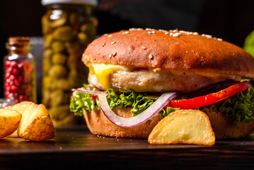 Delicious fresh homemade burger on a wooden table