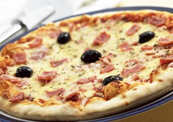 Pizza with Tomato, Cheese, Ham and Olives