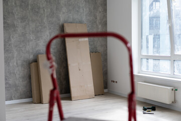 Interior of apartment with materials during on the renovation and construction, remodel wall from gypsum plasterboard or drywall