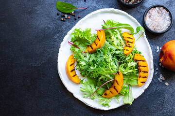 grilled peach salad lettuce leaves mix nectarine ingredient organic eating healthy top view place for text copy space keto or paleo diet raw