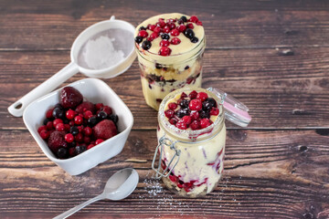 fresh red berry trifle in a jar 