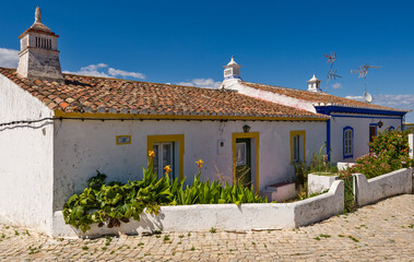 Fototapeta na wymiar traditional white openwork chimney at Cacela Velha, Algarve, Portugal