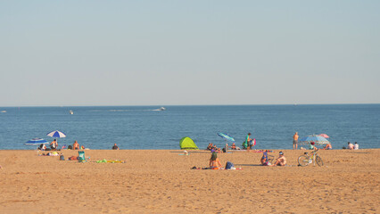 Fototapeta na wymiar landscape of beach , unrecognized people at coney island beach NY