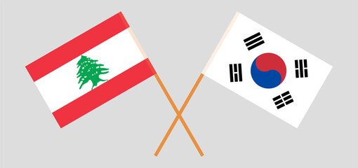 Crossed flags of Lebanon and South Korea