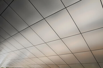 Ceiling panel background with copy space for adding text
Nice light gradation with a natural warm gray smoke hue tint

