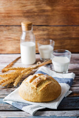 Wheat white bread with glasses of milk
