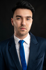 Portrait of business man wearing blue business suit and tie